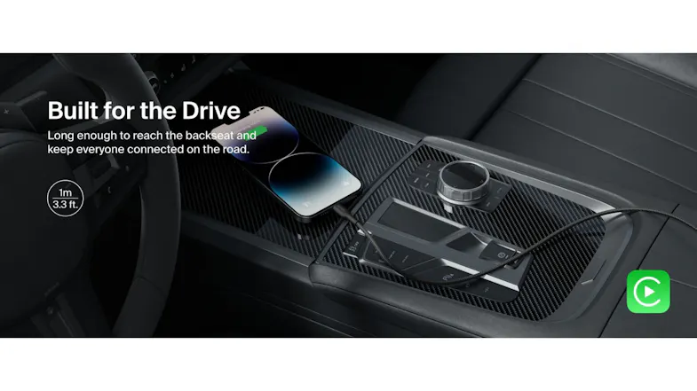 Braided cable charging a phone in a car's centre console with "Built for the Drive" text Braided cable charging a phone in a car's centre console with "Built for the Drive" text