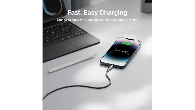 Lifestyle image of an iPhone charging on a desk using the black Belkin USB‑A to Lightning cable Lifestyle image of an iPhone charging on a desk using the black Belkin USB‑A to Lightning cable