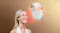 The LED face mask floats in front of a person’s face, illustrating light therapy coverage The LED face mask floats in front of a person’s face, illustrating light therapy coverage