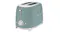 Angled front view of the Smeg 2‑slice toaster in matte green, showing rounded retro styling Angled front view of the Smeg 2‑slice toaster in matte green, showing rounded retro styling