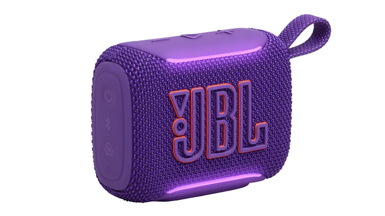 Angled front-left view of the purple JBL speaker, the grille and bold JBL logo are visible Angled front-left view of the purple JBL speaker, the grille and bold JBL logo are visible