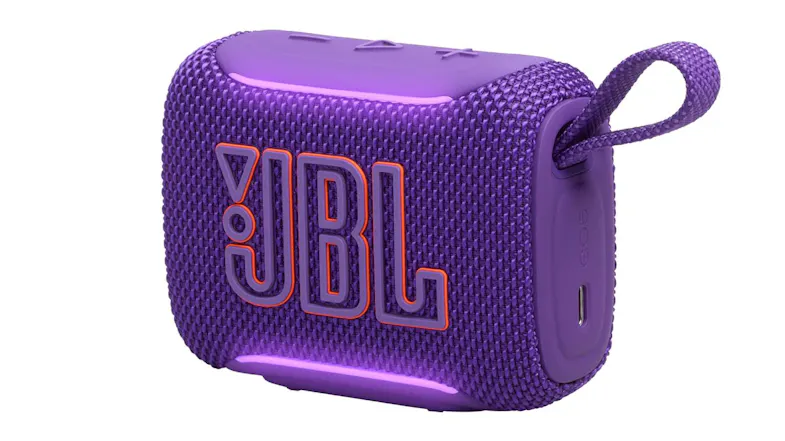 Angled front-right view of the speaker in purple with the USB‑C charging port visible Angled front-right view of the speaker in purple with the USB‑C charging port visible