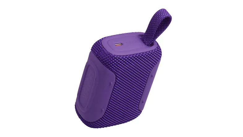 Rear angled view of the speaker in purple, showing the right-side rubber panel Rear angled view of the speaker in purple, showing the right-side rubber panel