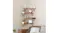 Solid wood corner shelves installed on the wall, displaying plants, a clock, and a framed photo Solid wood corner shelves installed on the wall, displaying plants, a clock, and a framed photo