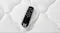 Top‑down close‑up of a black Sealy remote control placed on the mattress surface Top‑down close‑up of a black Sealy remote control placed on the mattress surface