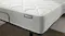 Close‑up of the mattress corner highlighting the white quilted comfort layer and textured grey side panel Close‑up of the mattress corner highlighting the white quilted comfort layer and textured grey side panel