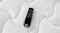 Top‑down close‑up of a black Sealy remote control resting on the white quilted mattress surface Top‑down close‑up of a black Sealy remote control resting on the white quilted mattress surface