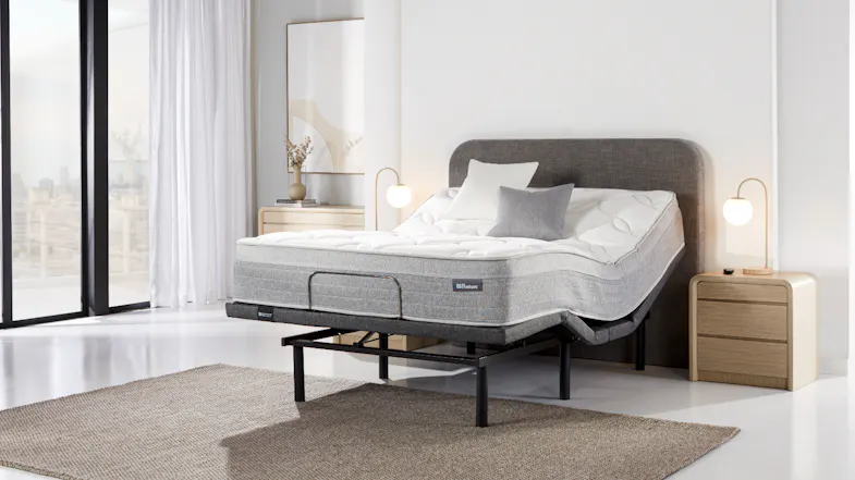 Side angled view of the adjustable base with the head section raised higher Side angled view of the adjustable base with the head section raised higher