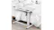 Adjustable side table with a white steel frame and a marble‑look top placed beside a bed Adjustable side table with a white steel frame and a marble‑look top placed beside a bed