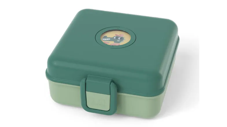 Monbento Snacky children’s bento snack box in green with a hinged lid, and playful animal window detail Monbento Snacky children’s bento snack box in green with a hinged lid, and playful animal window detail