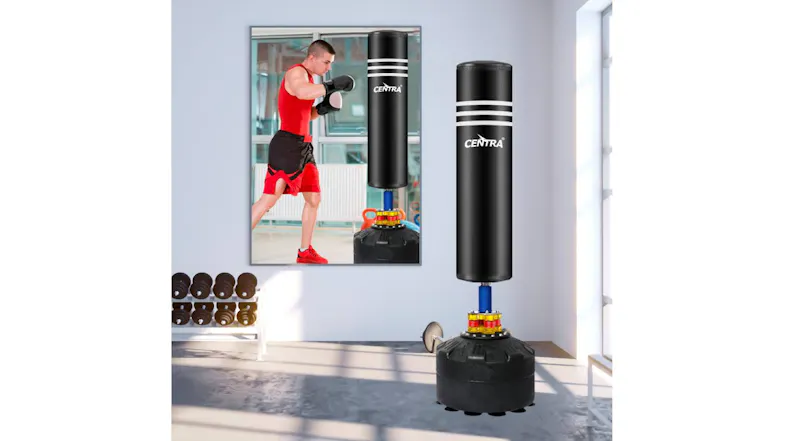 Gym‑style setting with the Centra punching bag standing upright. A person throws a punch toward the bag Gym‑style setting with the Centra punching bag standing upright. A person throws a punch toward the bag