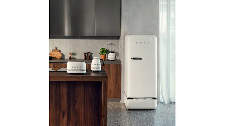 Full Smeg Porsche appliance range including a fridge, toaster, kettle, and blender in a kitchen Full Smeg Porsche appliance range including a fridge, toaster, kettle, and blender in a kitchen