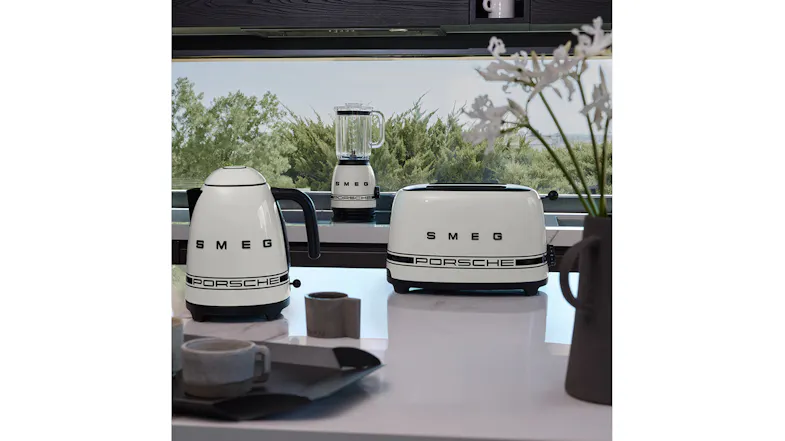 A matching collection of white Smeg Porsche Edition appliances styled in a bright kitchen A matching collection of white Smeg Porsche Edition appliances styled in a bright kitchen
