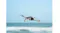 Front view of the quadcopter hovering over ocean waves Front view of the quadcopter hovering over ocean waves