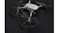 Top-down view of a grey drone with black circular propeller guards Top-down view of a grey drone with black circular propeller guards