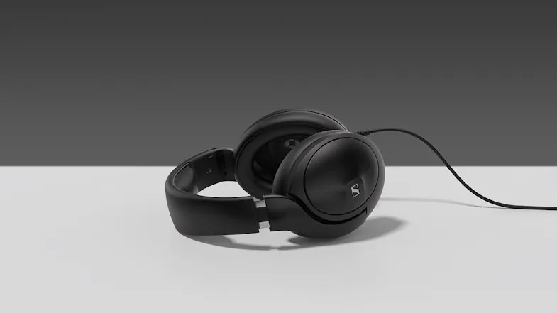 A pair of Sennheiser HD 620S wired headphones resting on a plain white surface against a grey background A pair of Sennheiser HD 620S wired headphones resting on a plain white surface against a grey background