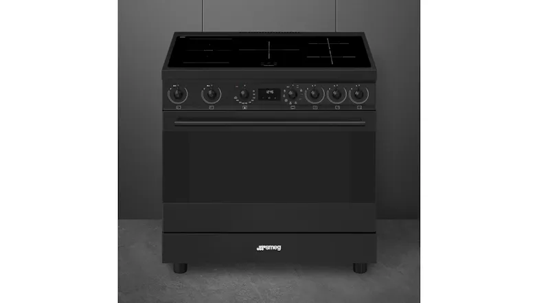 Front view of the Smeg appliance positioned against a dark grey wall Front view of the Smeg appliance positioned against a dark grey wall