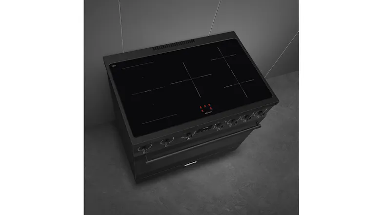 High-angle shot of the five-zone glass induction cooktop surface High-angle shot of the five-zone glass induction cooktop surface