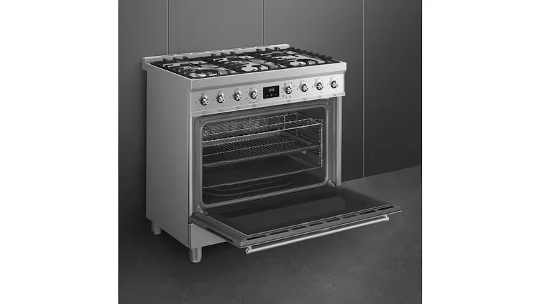 Interior view of the Smeg oven with empty racks and tray Interior view of the Smeg oven with empty racks and tray