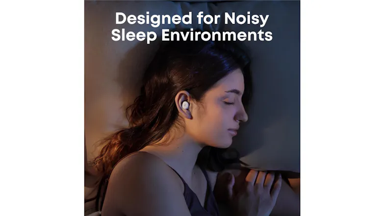 A woman sleeping peacefully with a small earbud in her ear A woman sleeping peacefully with a small earbud in her ear