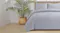 Stone-coloured Malmo comforter set styled on a bed with two matching pillows Stone-coloured Malmo comforter set styled on a bed with two matching pillows