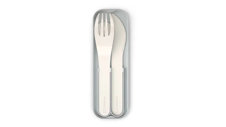 Monbento Pocket portable cutlery set with white fork, spoon, and knife neatly stored in a grey reusable case Monbento Pocket portable cutlery set with white fork, spoon, and knife neatly stored in a grey reusable case