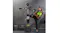 A person practising a kick on a freestanding boxing trainer inside a gym setting A person practising a kick on a freestanding boxing trainer inside a gym setting