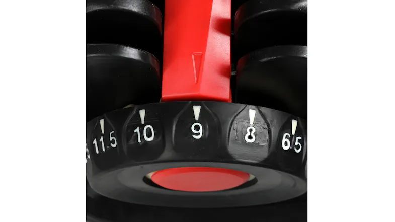 Detailed view of the weight dial showing numbered increments and the selector indicator Detailed view of the weight dial showing numbered increments and the selector indicator