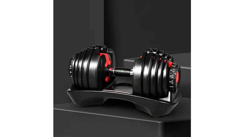 Adjustable dumbbell set displayed on a stand against a dark studio background Adjustable dumbbell set displayed on a stand against a dark studio background