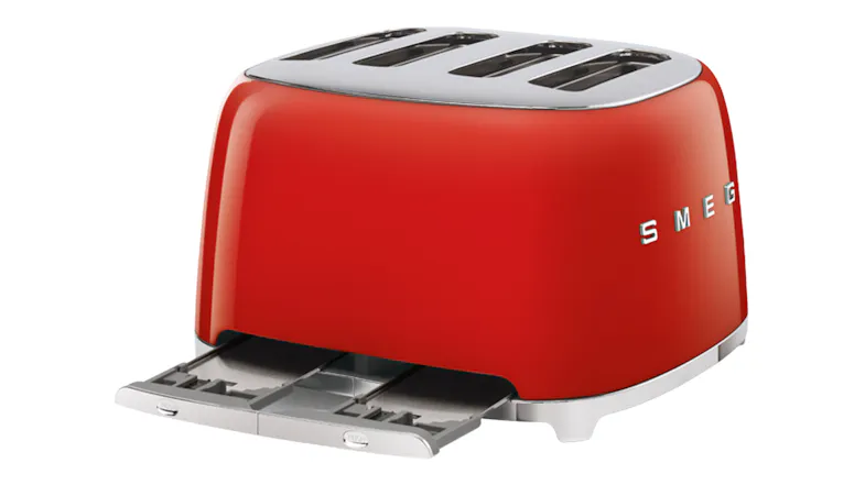 A rear view of the toaster with its removable crumb trays oulled out A rear view of the toaster with its removable crumb trays oulled out