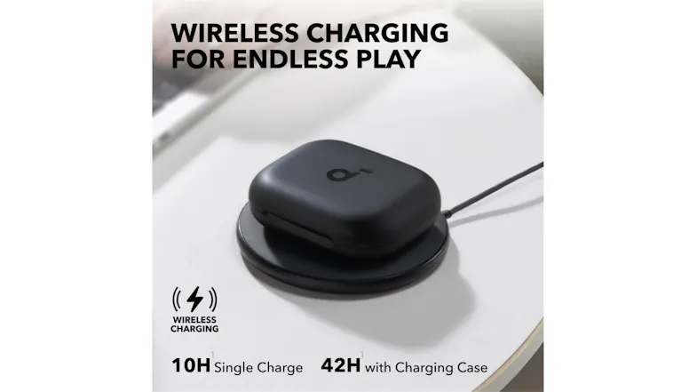 Black charging case resting on a circular wireless pad Black charging case resting on a circular wireless pad