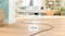 12-metre-long cable of the vacuum cleaner extending across a light wood floor 12-metre-long cable of the vacuum cleaner extending across a light wood floor