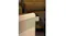 Lifestyle view of the Olimpia heater in a warm-lit living room Lifestyle view of the Olimpia heater in a warm-lit living room