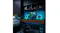 Dark room setup with teal backlighting and a gaming console on the dock Dark room setup with teal backlighting and a gaming console on the dock