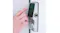 Hand entering a code on a Lockly smart door lock with touchscreen keypad and fingerprint sensor Hand entering a code on a Lockly smart door lock with touchscreen keypad and fingerprint sensor