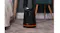 Low-angle view of the fan with a glowing orange light at the base Low-angle view of the fan with a glowing orange light at the base