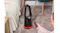 Hand holding a remote pointed toward a heater base Hand holding a remote pointed toward a heater base