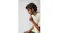 Close-up profile of a man with curly hair wearing Skullcandy headphones Close-up profile of a man with curly hair wearing Skullcandy headphones