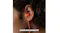 Close-up view of red earbud in ear with "NOISE ISOLATING FIT" text Close-up view of red earbud in ear with "NOISE ISOLATING FIT" text