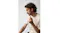 Side profile of a man wearing Skullcandy wired headphones Side profile of a man wearing Skullcandy wired headphones