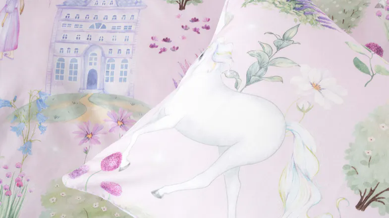 A detailed view of the fabric design, highlighting a graceful white unicorn with a shimmering mane A detailed view of the fabric design, highlighting a graceful white unicorn with a shimmering mane