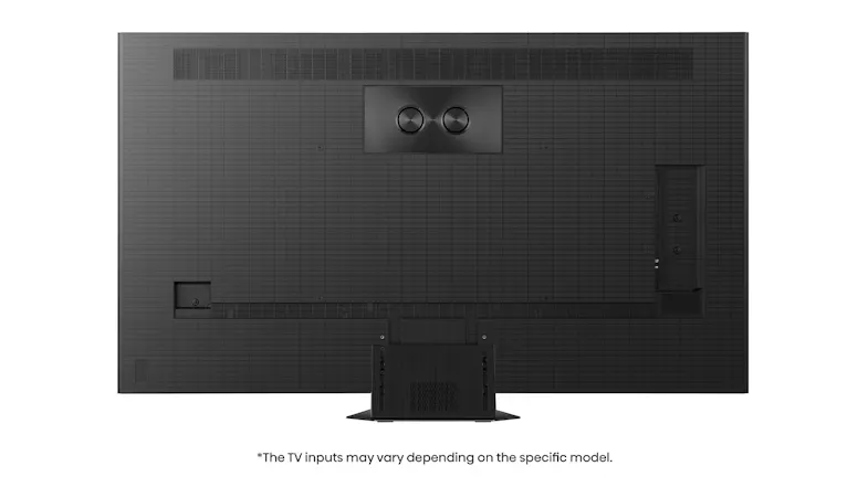 Rear view of the TV showing a textured back panel, dual circular subwoofer housings near the top Rear view of the TV showing a textured back panel, dual circular subwoofer housings near the top