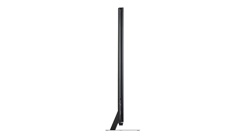 Side profile of the TV showing the ultra‑thin screen edge and integrated speaker grille along the side Side profile of the TV showing the ultra‑thin screen edge and integrated speaker grille along the side