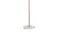 Close‑up of the lower pole and round white base of a gold freestanding coat rack Close‑up of the lower pole and round white base of a gold freestanding coat rack