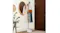 White coat rack holding a hat, bag, and clothing in a home entryway near a mirror and door White coat rack holding a hat, bag, and clothing in a home entryway near a mirror and door