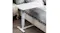 A side table used as a bedside workstation with a marble‑look top and a stable frame in a modern bedroom setting A side table used as a bedside workstation with a marble‑look top and a stable frame in a modern bedroom setting