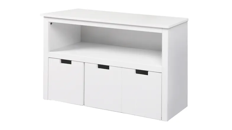 White Levede children’s storage unit with a flat top, an open shelf, and three front storage compartments White Levede children’s storage unit with a flat top, an open shelf, and three front storage compartments