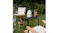 Outdoor tea setup with a Smeg Porsche kettle, wooden chairs, and a badminton racket on the grass Outdoor tea setup with a Smeg Porsche kettle, wooden chairs, and a badminton racket on the grass