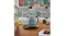 A Porsche edition Smeg kettle sits on a coffee table alongside apples and a mug in a cosy home setting A Porsche edition Smeg kettle sits on a coffee table alongside apples and a mug in a cosy home setting