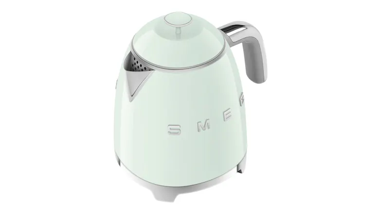 Elevated perspective of the 50's style kettle with the round lid button Elevated perspective of the 50's style kettle with the round lid button